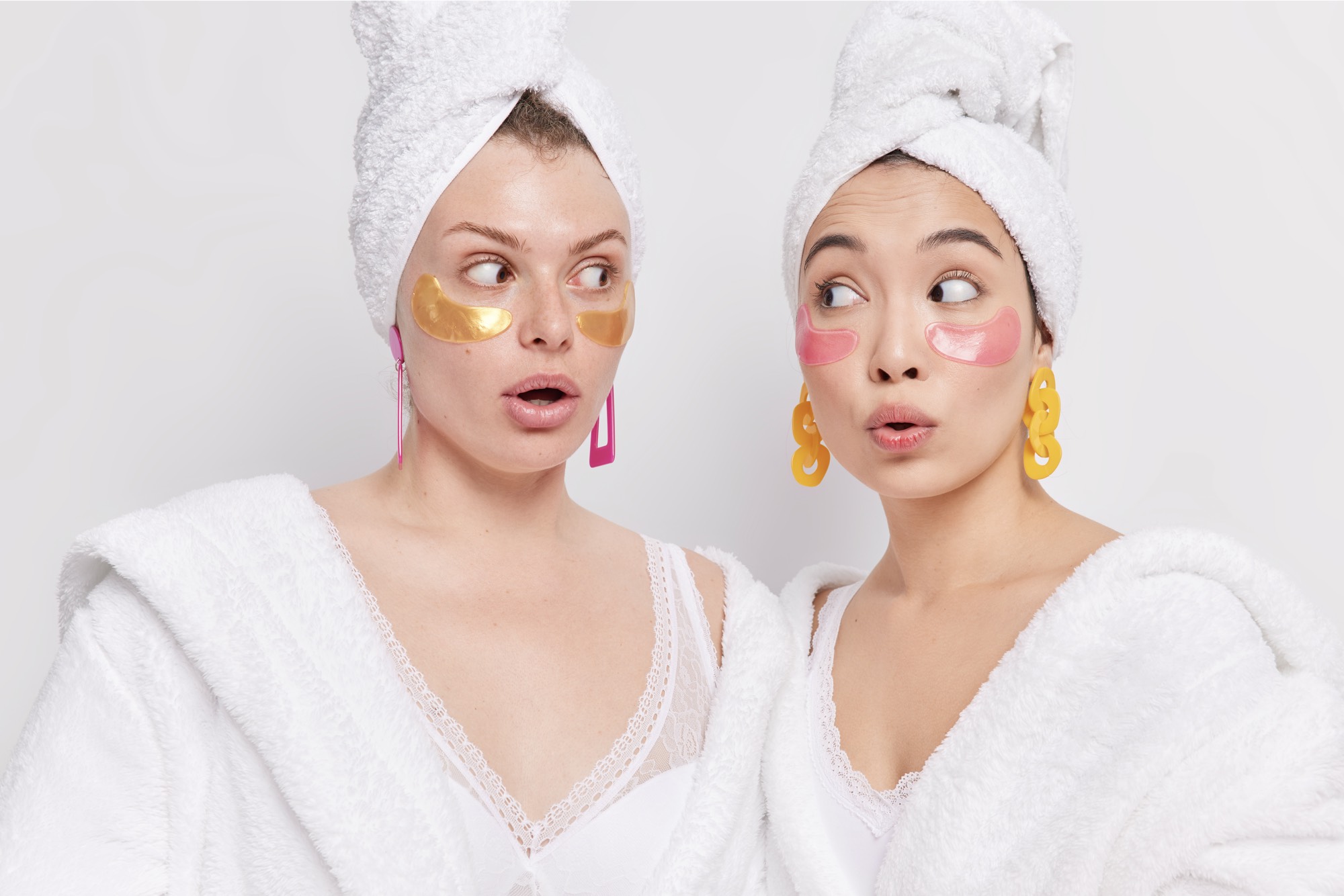 surprised ladies-look-with-wonder-each-other-test-new-eye-patches